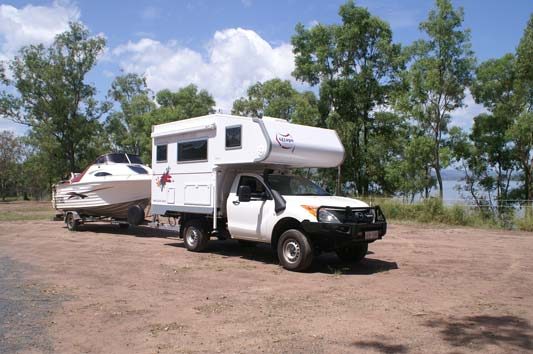 Ozcape Campers Slide-On motorhome Optima with boat in tow