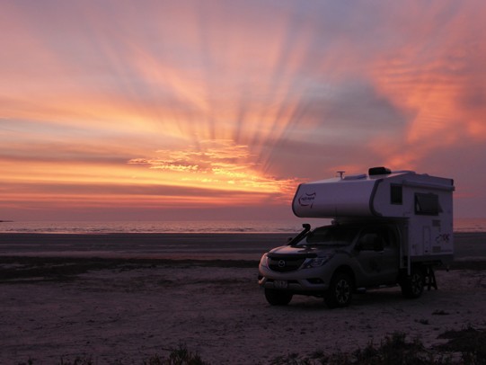 Ozcape Slide-On motorhome Woondabaa on beach at spectacular sunset