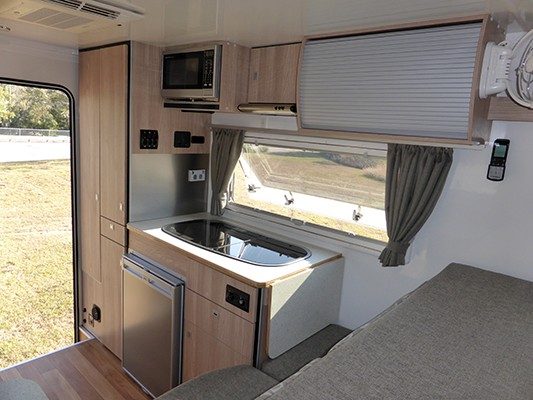 Ozcape Slide-On camper Woondabaa kitchen block completely equipped with Microwave and rangehood