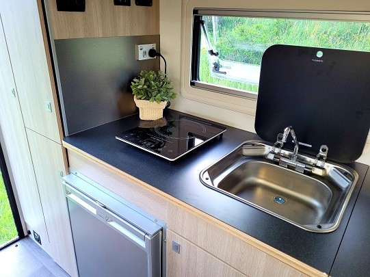 Ozcape Shorta kitchen with fridge, induction cooker and sink