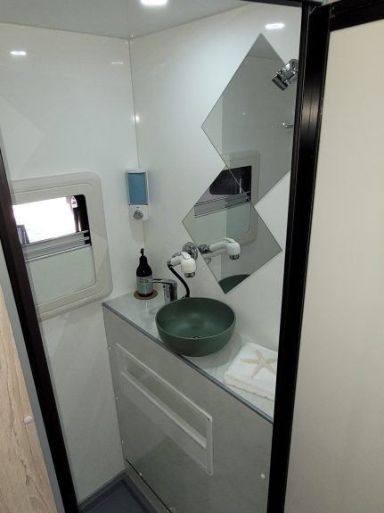 Bathroom of Ozcape Slide-On with shower, toilet and vanity