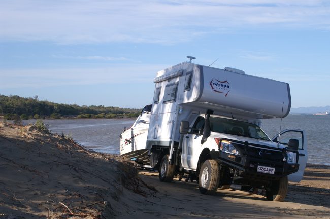 Ozcape Optima Slide-On on Mazda BT50 towing a boat on the beach.